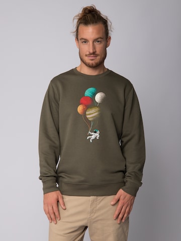 Felpa ' Balloon Spaceman ' di Watapparel in verde: frontale