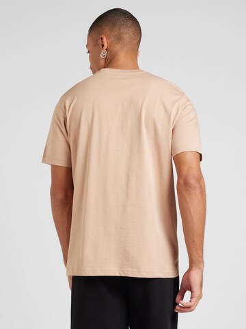 Maglietta di Champion Authentic Athletic Apparel in marrone