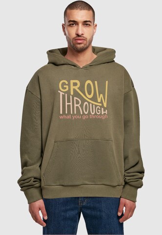 Merchcode Sweatshirt 'Spring - Grow through 2' in Groen: voorkant