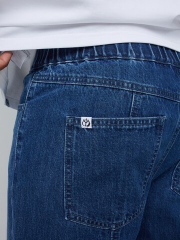 ABOUT YOU x Benny Cristo Tapered Jeans 'Simon' i blå