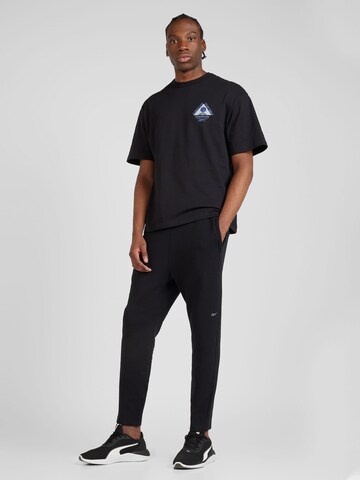 Reebok - regular Pantalón deportivo 'ACTIV COLL DREAMBLEND' en negro