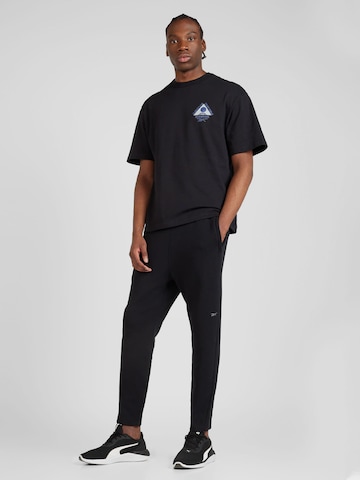 Reebok regular Παντελόνι φόρμας 'ACTIV COLL DREAMBLEND' σε μαύρο