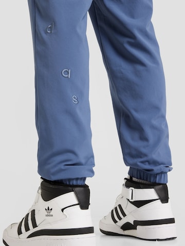 ADIDAS SPORTSWEAR Tapered Workout Pants in Blue