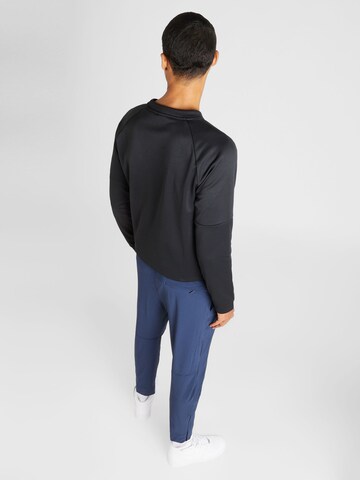 NIKE Tapered Sportbroek 'UNLIMITED' in Blauw