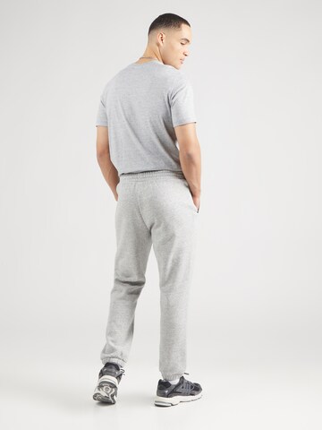 Tapered Pantaloni di Champion Authentic Athletic Apparel in grigio