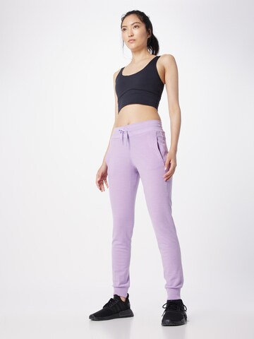 Effilé Pantalon de sport 'Crush' ICEBREAKER en violet