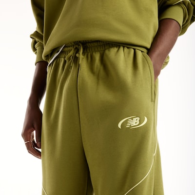 new balance Pantalon 'Trackside' en 34 en jaune pastel / olive, Vue avec produit
