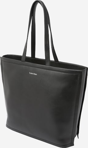 Plase de cumpărături de la Calvin Klein pe negru: față