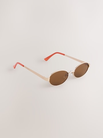 Lunettes de soleil Next en or