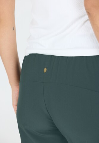 Athlecia Tapered Sportbroek 'Austberg' in Groen
