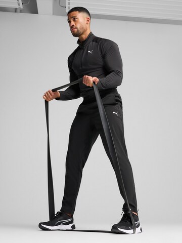 PUMA - Tapered Pantalón deportivo 'TAD Essentials' en negro