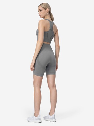 Skinny Pantaloni sportivi di 4F in grigio