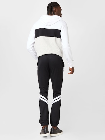 FILA Tapered Sports trousers 'ZVOLEN' in Black