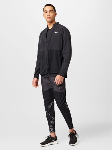 NIKE Tapered Sportbroek in Zwart