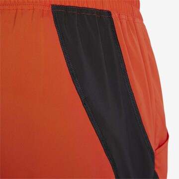 PUMA Regular Workout Pants in Orange