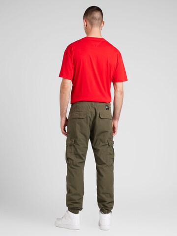 Effilé Pantalon cargo 'ETHAN' Tommy Jeans en vert