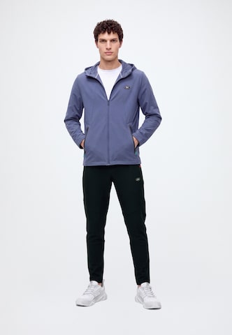 UNDER ARMOUR - Tapered Pantalón deportivo en negro