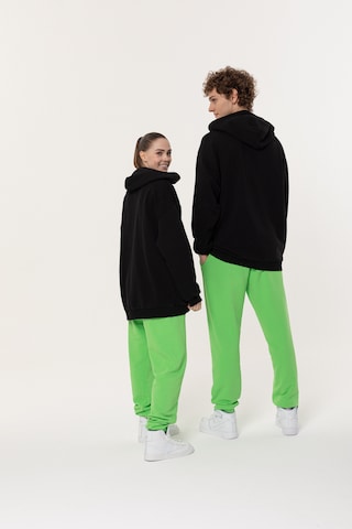 Loosefit Pantaloni sportivi di ET Nos in verde