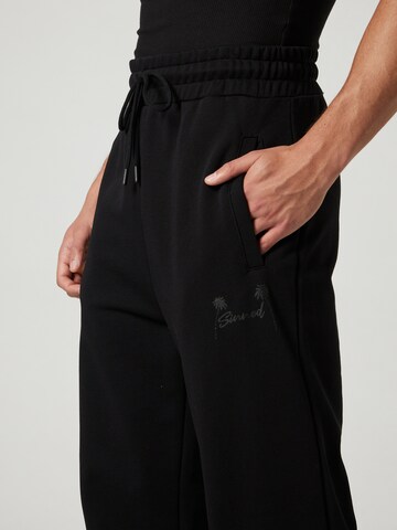 Sinned x ABOUT YOU Regular Trousers 'CURT' in Black