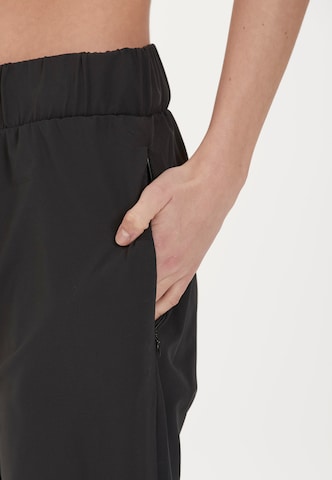 Athlecia - Tapered Pantalón deportivo 'Austberg' en negro
