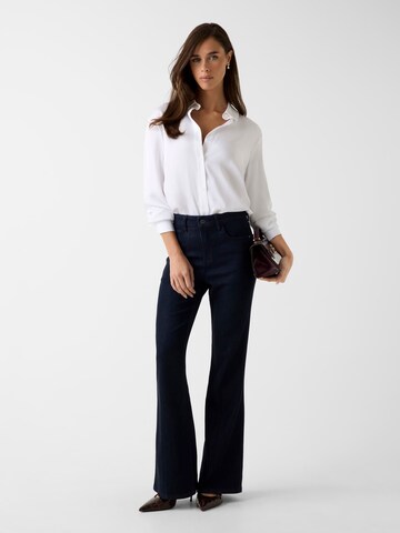 GUESS Tapered Jeans in Blue