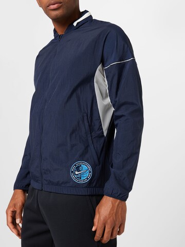 Veste de sport NIKE en bleu