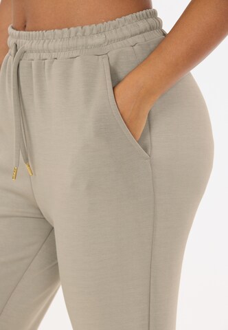 Athlecia Tapered Sports trousers 'Jacey' in Brown