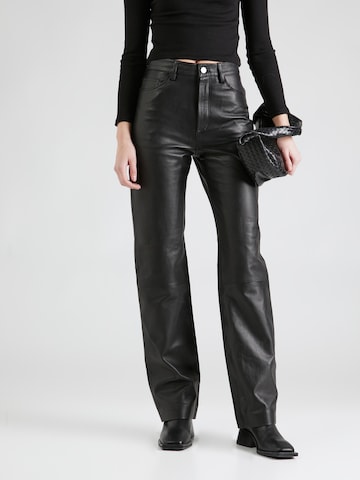 REMAIN Regular Trousers in Black: front