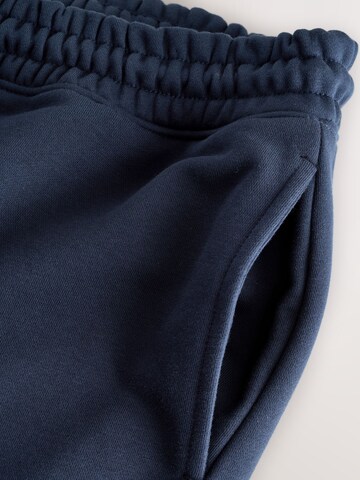 Next - Tapered Calças em azul