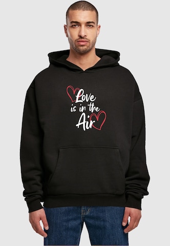 Merchcode Sweatshirt 'Valentines Day - Love Is In The Air' in Zwart: voorkant