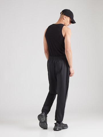 ELLESSE - Tapered Calças em preto