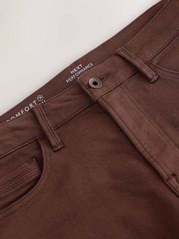 Next Slimfit Farkut värissä ruskea