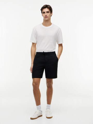 Loosefit Pantalon chino TOMMY HILFIGER en noir