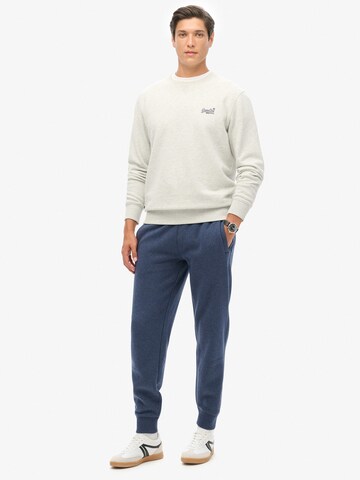 Superdry Tapered Broek 'Essential' in Blauw