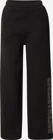 Hoermanseder x About You Wide leg Trousers in Black: front