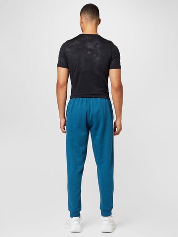 UNDER ARMOUR Regular Sportbroek in Blauw