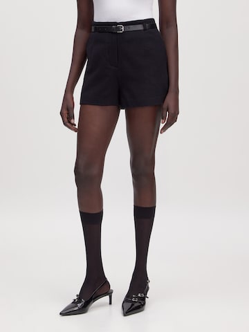 EDITED Loose fit Trousers in Black: front