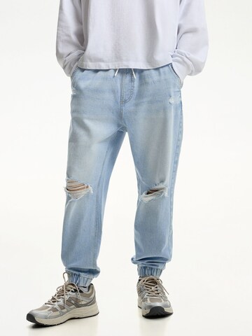 Tapered Jeans di Bershka in blu: frontale
