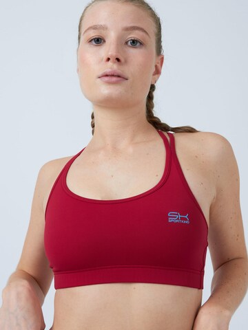 SPORTKIND Medium Support Sports bra 'Sport BH gekreuzte Träger' in Red: front
