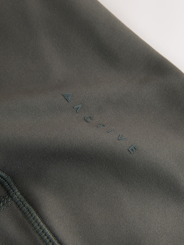 Next - Acampanado Pantalón deportivo en verde