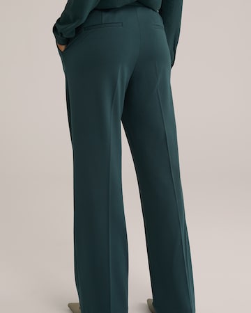 WE Fashion Loose fit Trousers with creases in Green
