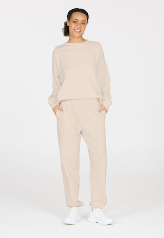 Athlecia Regular Sports trousers in Beige