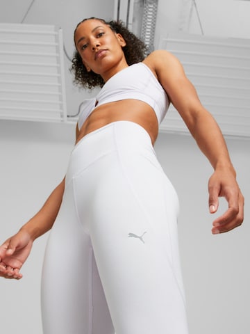 Skinny Pantaloni sportivi di PUMA in grigio: frontale