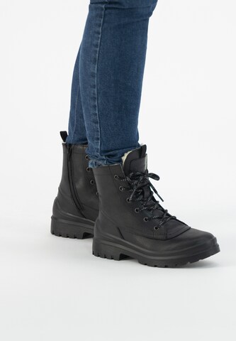 Travelin Lace-Up Boots in Black: front