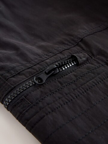 Next Normální Kapsáče – černá