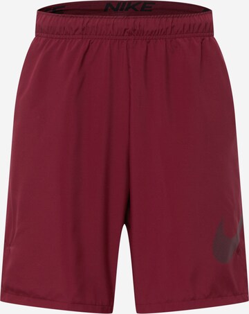 NIKE Workout Pants in Red: front