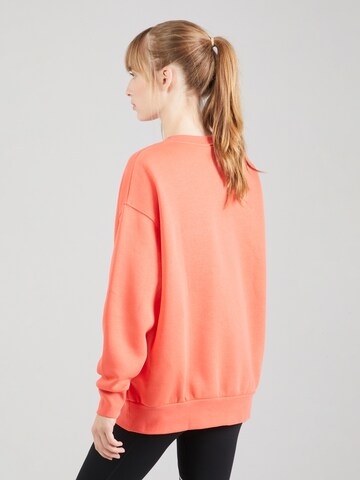 UNDER ARMOUR Sports sweatshirt in Red