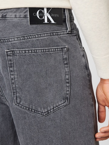 Calvin Klein Jeans Zvonové kalhoty Džíny – šedá