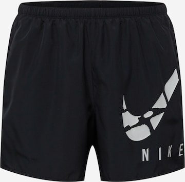 NIKE Regular Workout Pants in Black: front