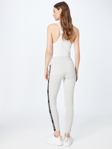 Skinny Pantaloni sportivi 'ALINE' di GUESS in grigio